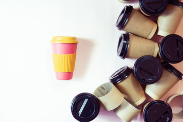 Zero waste concept Stylish reusable eco coffee cup vs multiple single use cardboard cups. Ban single use plastic.