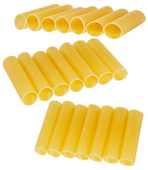 lose up of a stack of dried cannelloni pasta, a tubular pasta that is usually stuffed with meat or vegetables, on a white background. Italian cannelloni pasta tubes 