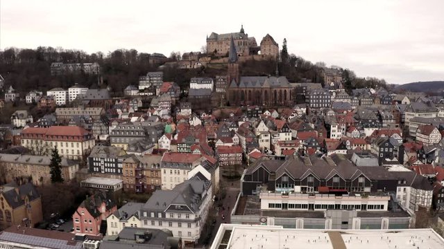Rising over the city of Marbug in central Germany. The university town is famous for its old town and the castle on the hill.