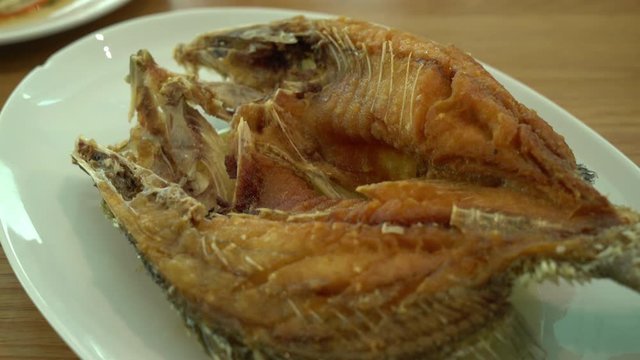 Fried snapper fish topped with fish sauce