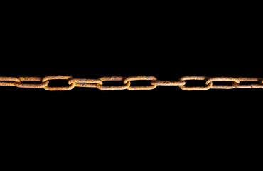 Fototapeta premium Rusty chains isolated on black background.
