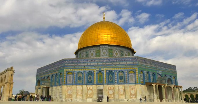 Time lapse of The Dome of The Rock, an Islamic shrine on the Temple Mount with cloudy blue sky.