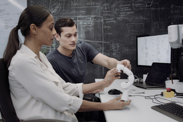 Robotics engineers in a brainstorm meeting