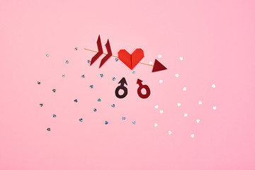 Sexual orientation concept. Colorful signs and symbols of free love. Pink background. Top view.