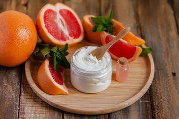 Concept of natural fruity organic ingredients in cosmetology. Extract of grapefruit for...