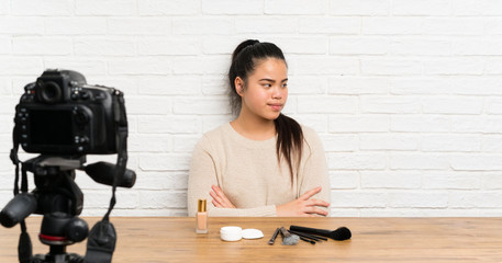 Young blogger Asian girl recording a video tutorial thinking an idea