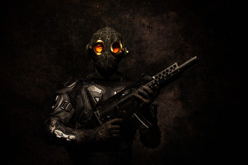 Portrait of a special forces soldier holding an assault rifle in his hands © Warpedgalerie