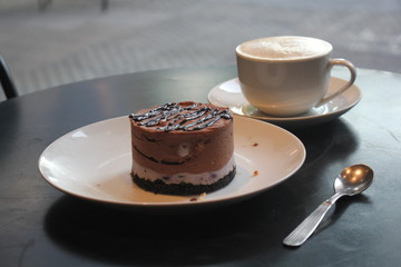 cup of coffee and chocolate cake