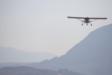 Fototapeta na wymiar Cessna approaching runway