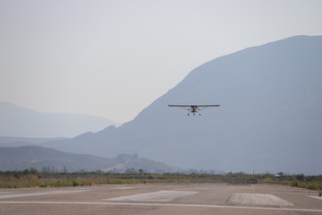 Cessna above runway