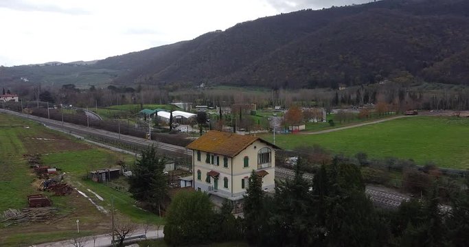 Cantoniera residential house aerial orbit right across Frescobaldi vineyard Chianti countryside plantation. Arno river valley near Florence. Pontassieve, Tuscany. Italy