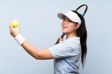 Young teenager Asian girl playing tennis