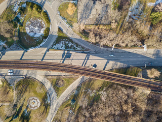 Aerial drone view. Kiev metro bridge over the road in sunny weather. The railway passes over the bridge.