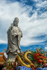 Fototapeta premium Big Standing Guan Yin and dragon in Suratthani,Thailand,Photo taken on:August 10th 2014