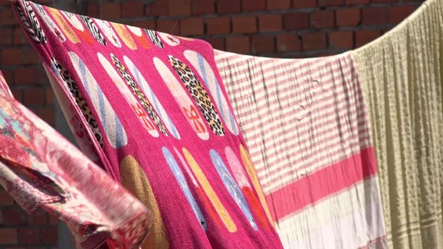 Washed Blankets Hanging on a Clothes Line to Dry in the Sunshine
