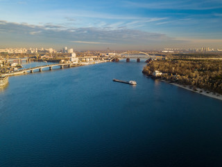 Fototapeta na wymiar Aerial view. A barge is sailing along the Dnieper in Kiev.