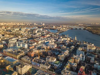 Zelfklevend Fotobehang Aerial drone view. View of the Podil district in Kiev on a sunny morning. © Sergey
