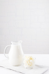 Homemade fermented beverage kefir with kefir grains in bowl on a white background, concept of natural fermented food and intestinal health