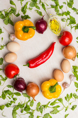 A set of vegetables for a healthy diet, yellow and red peppers, tomatoes, onions, garlic. .