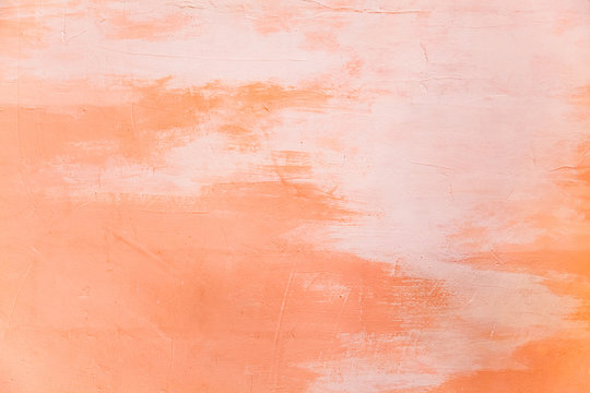 Closeup orange pantone color painted on wall surface background. House interior, home decorating, building exterior design, seamless decorative wallpaper pattern, architectural decoration concept