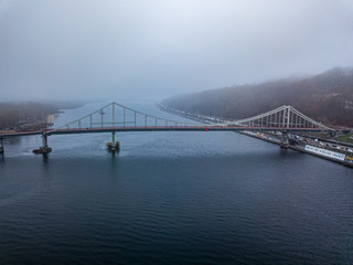 Aerial view. Footbridge in Kiev in dense fog