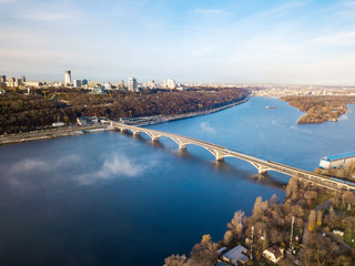 Obraz premium Aerial drone view. Metro bridge in Kiev on a foggy morning.