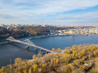 Fototapeta na wymiar Pedestrian park bridge in Kiev.. Aerial drone view.
