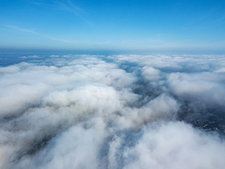 Aerial flight above clouds.