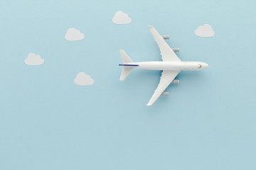 White top view Airplane . Airplane clouds blue cloud sky background with copy space for your text. Flat lay.