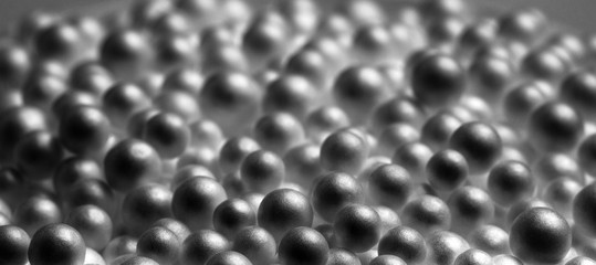 Abstract black and white background. Black foam balls. Mysterious objects, macro.