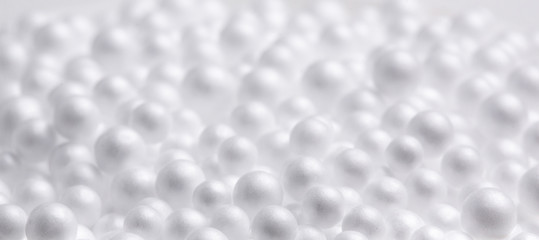 Abstract white background. White foam balls. Mysterious objects, macro.
