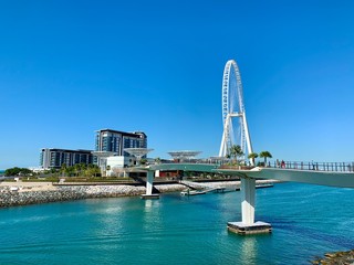 View on the ferris wheel and canal in Dubai