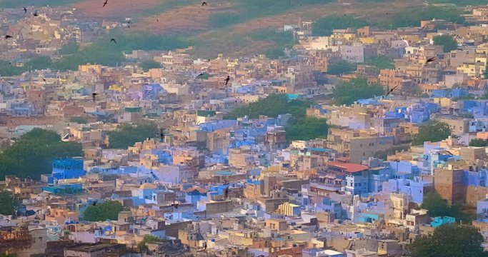 Houses and roofs of famous Jodhpur the Blue City, aerial view from Mehrangarh Fort, Rajasthan, India. Camera panning