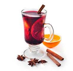 Mulled wine with spices, fruits and pine branch isolated on white background. 
