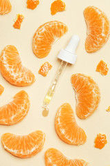 Tangerine essential oil, Eye dropper pipette and tangerine slices