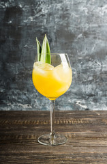 Pineapple cocktail in wine glass. Selective focus. Shallow depth of field.
