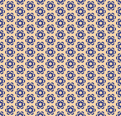 Vector golden geometric floral seamless pattern. Elegant deep blue and gold ornamental texture with small flowers, star shapes, snowflakes. Abstract festive background. Luxury repeat design for decor