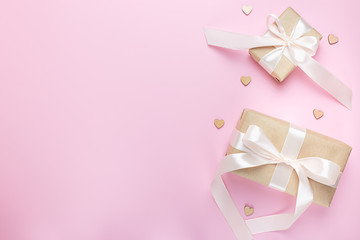 Two gift boxes on a pink background. Valentine's day. Holiday of lovers.