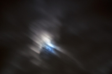 bright full moon with fast moving moonlit clouds