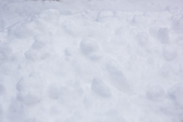 Fototapeta na wymiar pure white snow texture, snowdrift on the street in winter