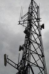 high voltage tower on background of gray sky