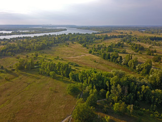 Fototapeta na wymiar Aerial view. Dnieper tributaries among the green shores on the outskirts of the city