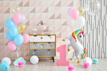 One year birthday decorations. A lot of balloons. 