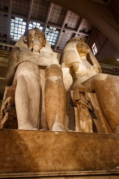 Colossal statues of Amenhotep III and Queen Tiye and their daughter Henuttaneb  in the Museum of Egyptian Antiquities in Cairo, Egypt