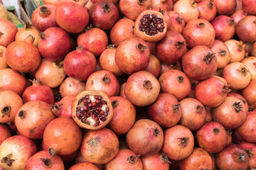 Fototapeta na wymiar Pile of ripe pomegranates