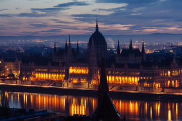 Fototapeta na wymiar Morning view of illuminated Parliament building in Budapest,