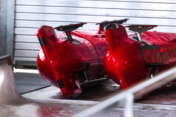 two bob sleds near an bob ice channel