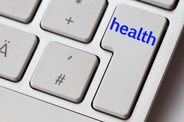 health as a concept on a silver computer keyboard as a symbol for internet medicine