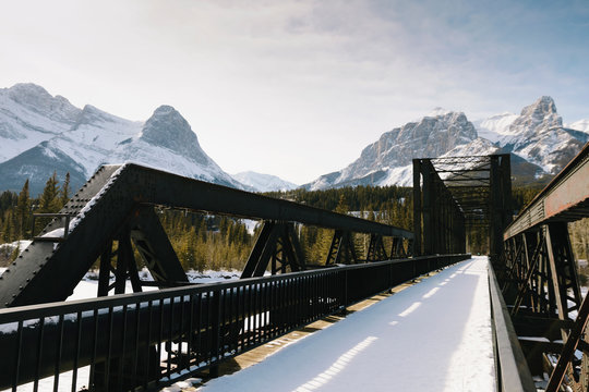 Snow Covered Bridge Below Mountains