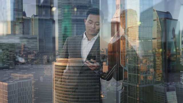 Real time portrait shot of a young businessman conducting correspondence on the phone. End of working day. Double exposure